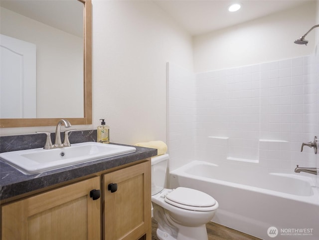 353 Mount Olympus Ave SE, Ocean Shores, WA 98569 - bathroom featuring toilet, shower / tub combination, vanity, wood finished floors, and recessed lighting