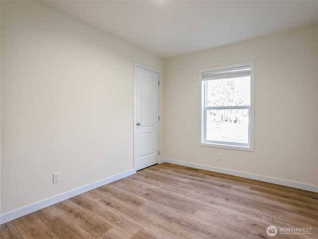 353 Mount Olympus Ave SE, Ocean Shores, WA 98569 - spare room featuring light wood-style floors and baseboards