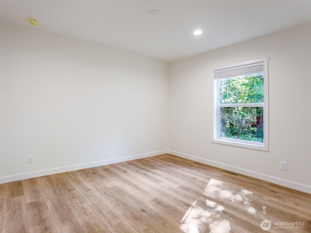 353 Mount Olympus Ave SE, Ocean Shores, WA 98569 - empty room featuring light wood-type flooring, baseboards, recessed lighting, and a smoke detector