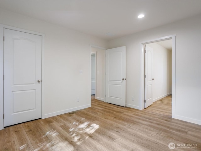 353 Mount Olympus Ave SE, Ocean Shores, WA 98569 - unfurnished bedroom with light wood finished floors, baseboards, and recessed lighting