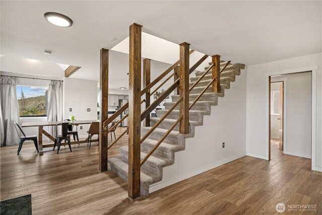12062 Neppel Rd, Moses Lake, WA 98837 - stairway featuring wood finished floors and baseboards