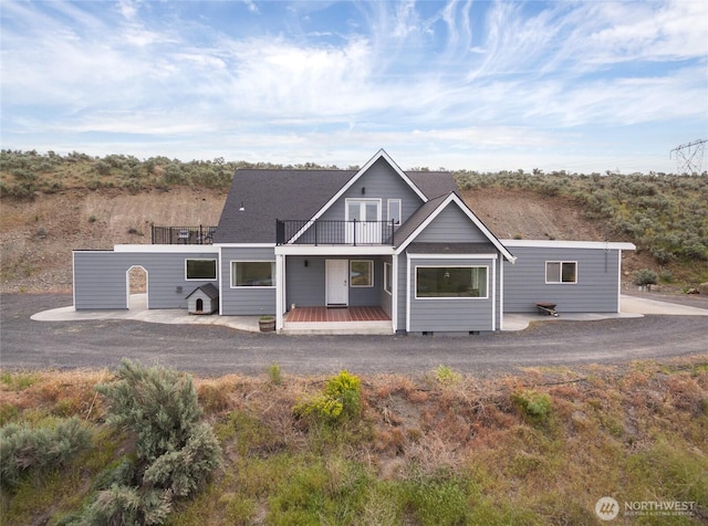 12062 Neppel Rd, Moses Lake, WA 98837 - back of house featuring a balcony, roof with shingles, and crawl space