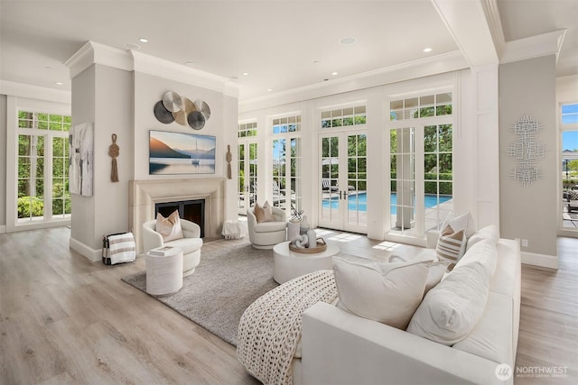 4207 Holly Ln, Mercer Island, WA 98040 - living room featuring crown molding, baseboards, french doors, wood finished floors, and recessed lighting
