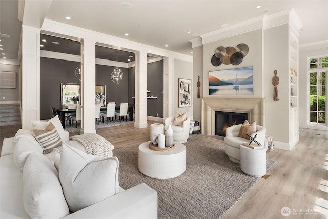 4207 Holly Ln, Mercer Island, WA 98040 - living room with crown molding, light wood finished floors, baseboards, a chandelier, and recessed lighting