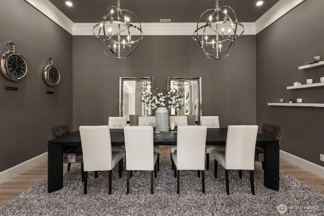 4207 Holly Ln, Mercer Island, WA 98040 - dining room with a chandelier, crown molding, wood finished floors, baseboards, and a high ceiling