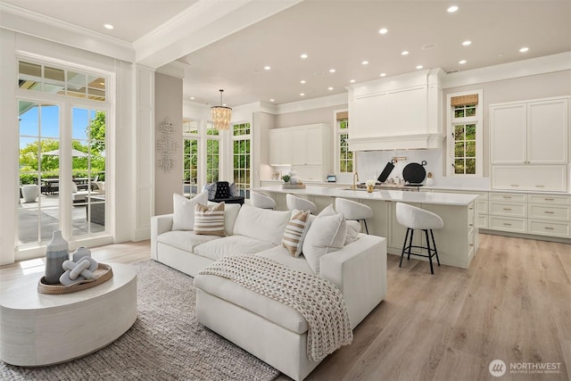 4207 Holly Ln, Mercer Island, WA 98040 - living room with recessed lighting, light wood-style flooring, ornamental molding, and healthy amount of natural light