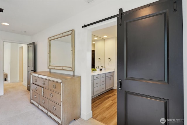 bathroom with recessed lighting, vanity, and baseboards