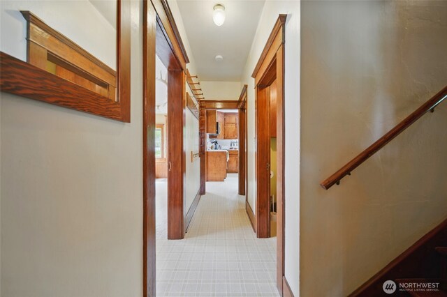 hallway with light colored carpet