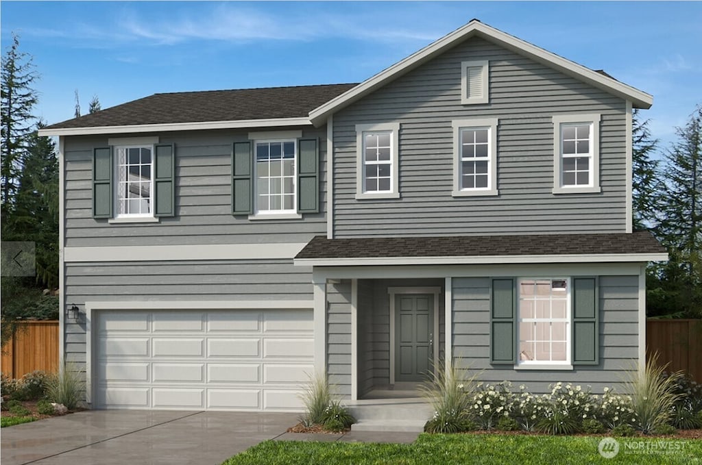 traditional-style home with fence, concrete driveway, a garage, and a shingled roof