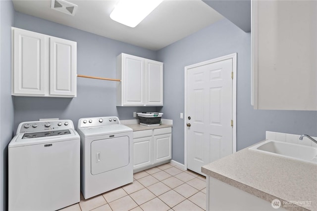 2149 Inglewood Dr, East Wenatchee, WA 98802 - washroom featuring cabinet space, washing machine and clothes dryer, and light tile patterned flooring