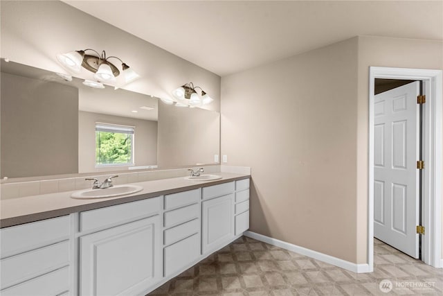 2149 Inglewood Dr, East Wenatchee, WA 98802 - full bath with tile patterned floors, double vanity, and baseboards