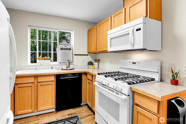 12549 Roosevelt Way NE Unit 13, Seattle, WA 98125 - kitchen with white appliances, light countertops, light wood finished floors, a sink, and cooling unit