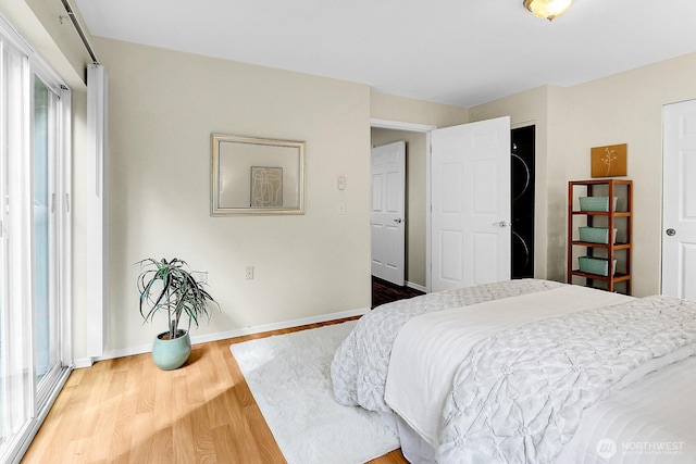 12549 Roosevelt Way NE Unit 13, Seattle, WA 98125 - bedroom with wood finished floors and baseboards