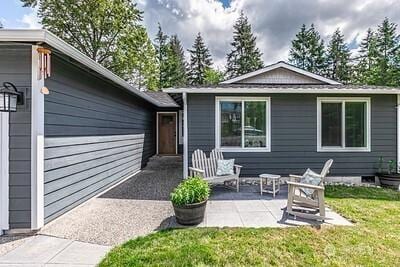 2117 130th Dr NE, Lake Stevens, WA 98258 - back of house featuring a patio area and a yard
