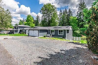 2117 130th Dr NE, Lake Stevens, WA 98258 - view of front of home featuring an attached garage and gravel driveway