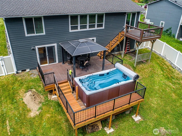 2117 130th Dr NE, Lake Stevens, WA 98258 - rear view of house with a hot tub, a deck, a gazebo, a shingled roof, and stairway