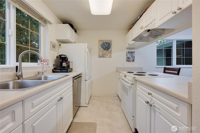 23313 Cedar Way Unit N205, Mountlake Terrace, WA 98043 - kitchen featuring white appliances, a sink, white cabinetry, and light countertops