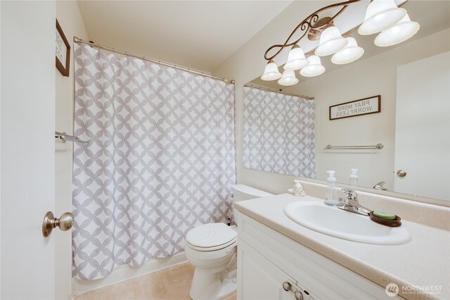 23313 Cedar Way Unit N205, Mountlake Terrace, WA 98043 - bathroom featuring toilet, vanity, shower / tub combo, and tile patterned flooring
