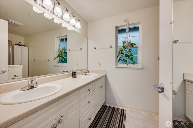 23313 Cedar Way Unit N205, Mountlake Terrace, WA 98043 - bathroom featuring double vanity and baseboards