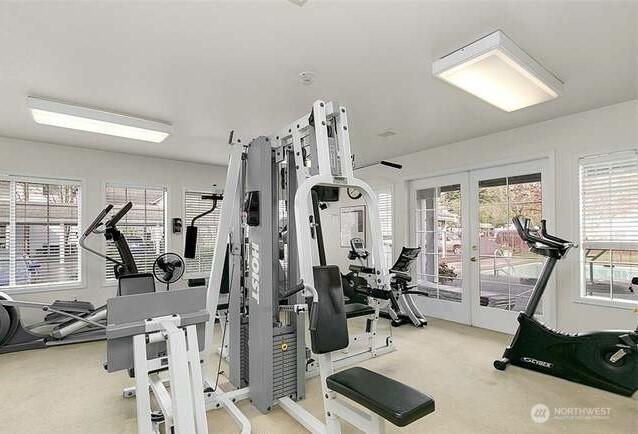 23313 Cedar Way Unit N205, Mountlake Terrace, WA 98043 - workout area with carpet flooring, french doors, and healthy amount of natural light
