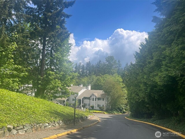 23313 Cedar Way Unit N205, Mountlake Terrace, WA 98043 - view of asphalt road featuring curbs
