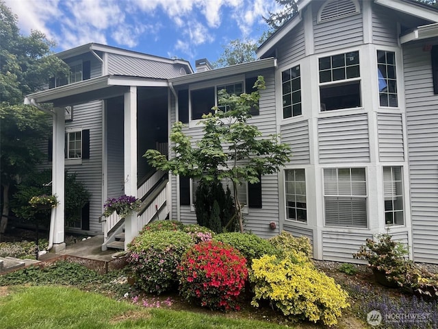23313 Cedar Way Unit N205, Mountlake Terrace, WA 98043 - view of side of property featuring a chimney