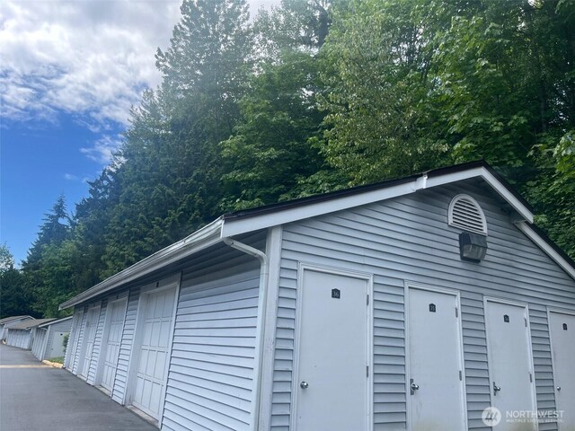 23313 Cedar Way Unit N205, Mountlake Terrace, WA 98043 - garage with view of scattered trees
