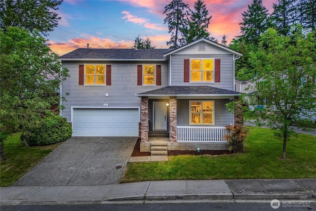 12570 SE 295th St, Auburn, WA 98092 - traditional-style home with covered porch, an attached garage, driveway, and a lawn