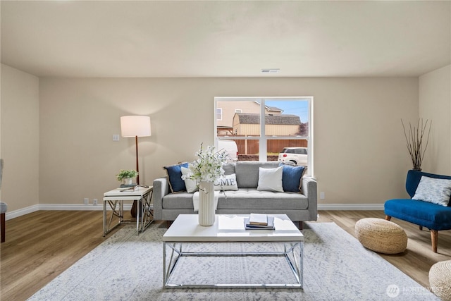 12570 SE 295th St, Auburn, WA 98092 - living area featuring baseboards and wood finished floors