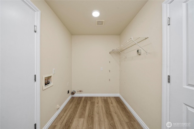 12570 SE 295th St, Auburn, WA 98092 - laundry area with hookup for a washing machine, light wood finished floors, and baseboards