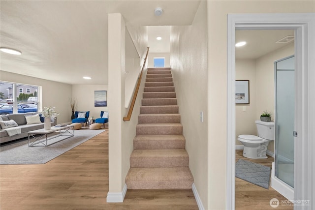 12570 SE 295th St, Auburn, WA 98092 - staircase with wood finished floors, healthy amount of natural light, baseboards, and recessed lighting