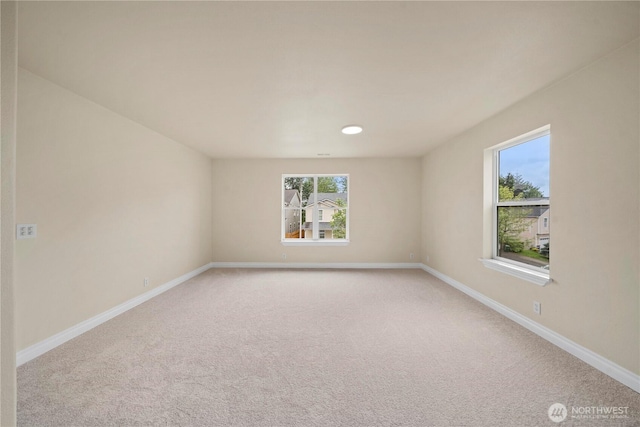 12570 SE 295th St, Auburn, WA 98092 - spare room featuring light colored carpet and baseboards