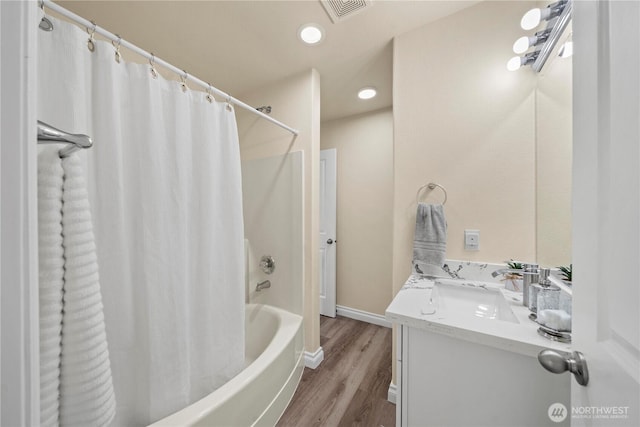 12570 SE 295th St, Auburn, WA 98092 - full bath featuring wood finished floors, shower / tub combo, vanity, recessed lighting, and baseboards