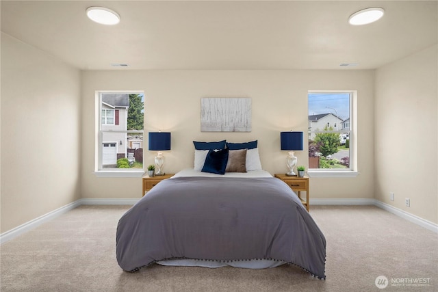 12570 SE 295th St, Auburn, WA 98092 - carpeted bedroom featuring baseboards and multiple windows