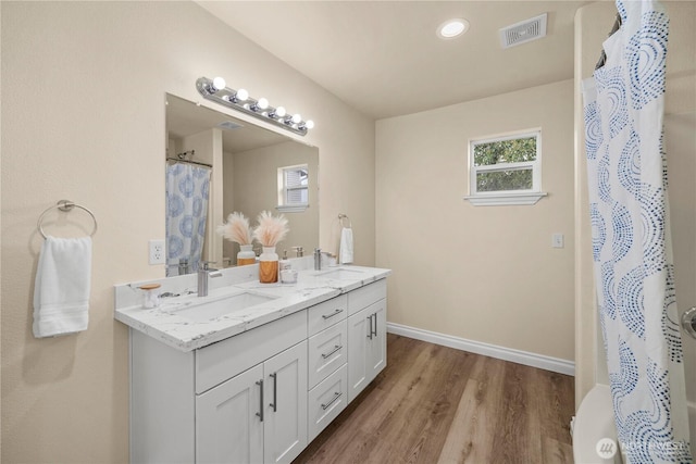 12570 SE 295th St, Auburn, WA 98092 - full bath featuring wood finished floors, double vanity, and baseboards