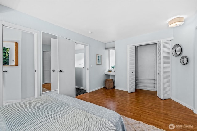 3527 E Spruce St, Seattle, WA 98122 - bedroom with wood finished floors, baseboards, and a closet