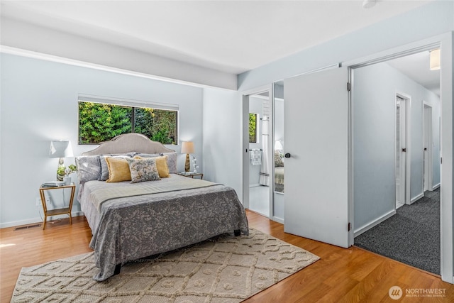 3527 E Spruce St, Seattle, WA 98122 - bedroom featuring wood finished floors and baseboards