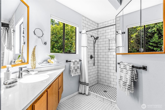 3527 E Spruce St, Seattle, WA 98122 - full bathroom with tiled shower, plenty of natural light, vanity, and tile patterned flooring