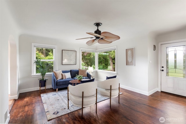 2016 Marine Dr, Bremerton, WA 98312 - living room featuring wood finished floors, baseboards, ceiling fan, and arched walkways