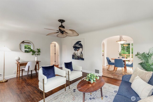 2016 Marine Dr, Bremerton, WA 98312 - living room with arched walkways, hardwood / wood-style floors, ceiling fan, and baseboards