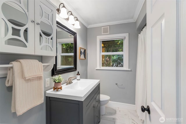 2016 Marine Dr, Bremerton, WA 98312 - bathroom with marble finish floors, healthy amount of natural light, toilet, baseboards, and crown molding