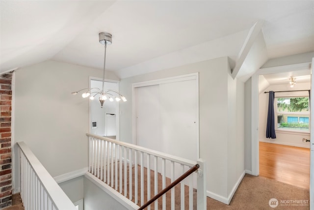 2016 Marine Dr, Bremerton, WA 98312 - hallway featuring an upstairs landing, lofted ceiling, carpet, a chandelier, and baseboards