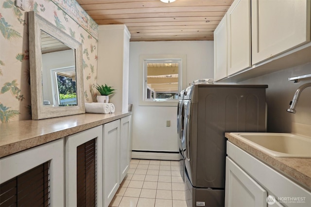 6324 NE 130th Pl, Kirkland, WA 98034 - laundry room with wood ceiling, cabinet space, a baseboard heating unit, light tile patterned floors, and wallpapered walls