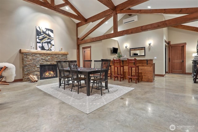 6324 NE 130th Pl, Kirkland, WA 98034 - dining space with beam ceiling, a fireplace, concrete flooring, recessed lighting, and a wall unit AC
