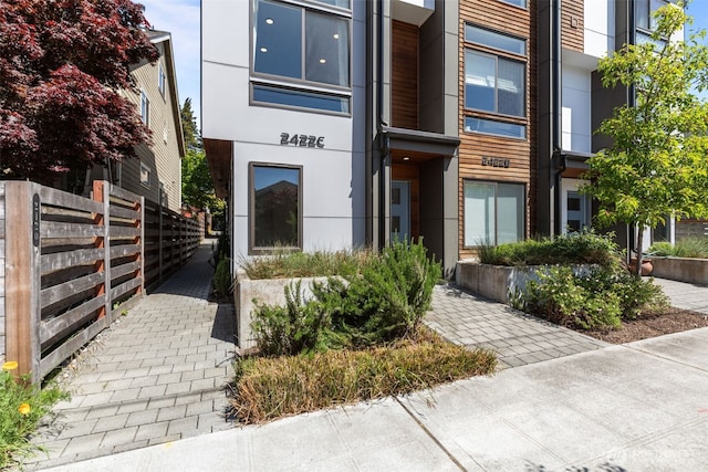 2422C NW 60th St, Seattle, WA 98107 - view of exterior entry with fence and stucco siding