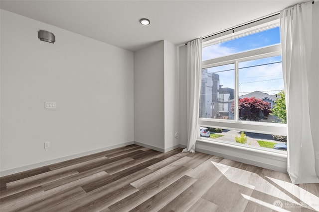 2422C NW 60th St, Seattle, WA 98107 - spare room featuring wood finished floors and baseboards