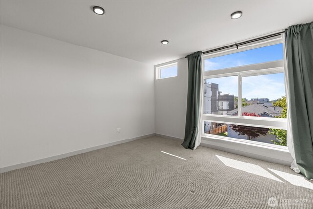 2422C NW 60th St, Seattle, WA 98107 - carpeted empty room with baseboards and recessed lighting