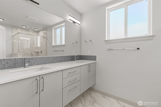 2422C NW 60th St, Seattle, WA 98107 - bathroom featuring a stall shower, baseboards, double vanity, and marble look tile flooring