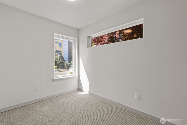2422C NW 60th St, Seattle, WA 98107 - unfurnished room featuring baseboards and carpet floors