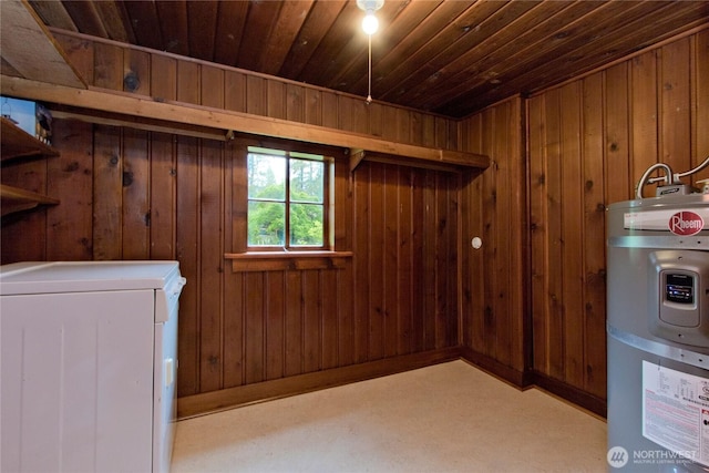 basement featuring secured water heater, washer / dryer, wood ceiling, wood walls, and carpet flooring